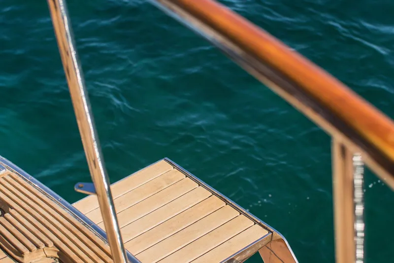 New School Yacht Photos Pics Wooden deck of 1966 Chris-Craft Constellation yacht with ocean view.