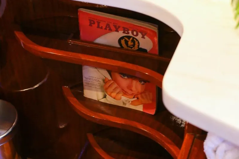 New School Yacht Photos Pics Vintage 1966 Chris-Craft Constellation interior with retro magazine display.