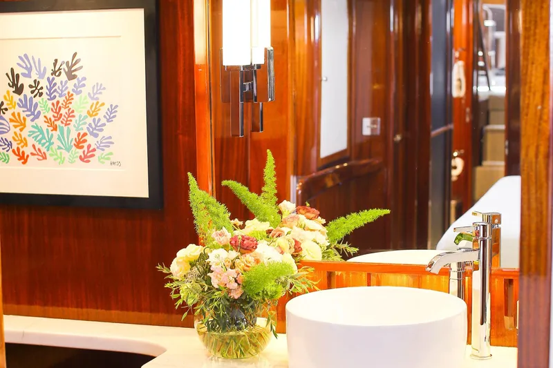 New School Yacht Photos Pics Luxurious 1966 Chris-Craft Constellation yacht interior with elegant decor and floral arrangement.