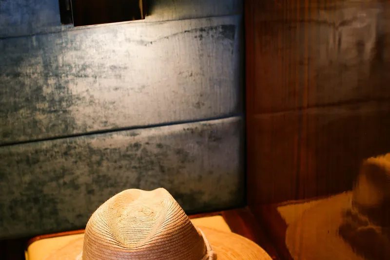New School Yacht Photos Pics Straw hat on a wooden surface inside a 1966 Chris-Craft Constellation boat.