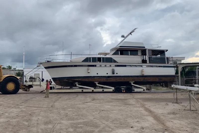 New School Yacht Photos Pics 1966 Chris-Craft Constellation yacht on trailer, cloudy sky background.