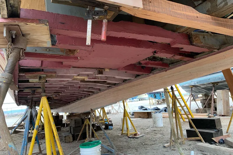 New School Yacht Photos Pics 1966 Chris-Craft Constellation under restoration, showing hull structure and support stands.