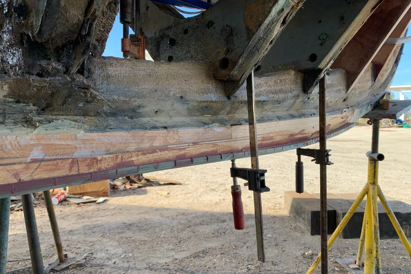 New School Yacht Photos Pics 1966 Chris-Craft Constellation undergoing hull restoration with clamps and supports.