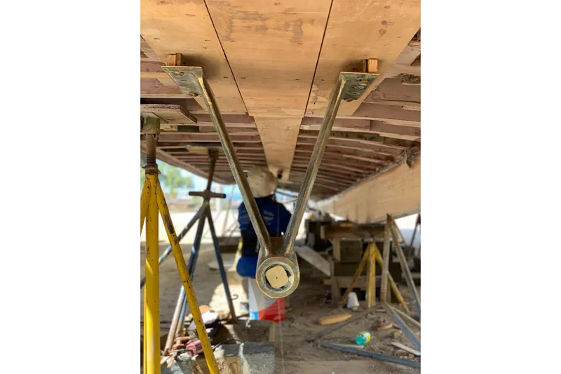 New School Yacht Photos Pics 1966 Chris-Craft Constellation under restoration, showing hull and support structures.