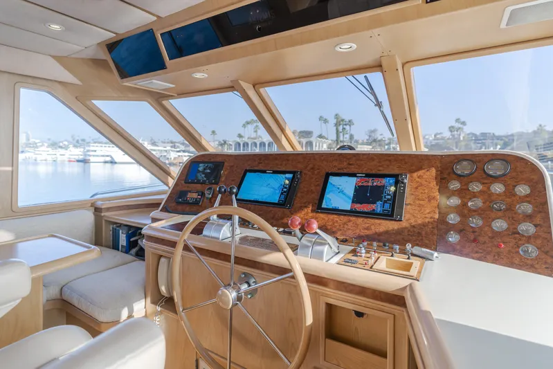 Artemis Yacht Photos Pics 1996 Offshore Yachts Pilothouse interior with navigation equipment and steering wheel.