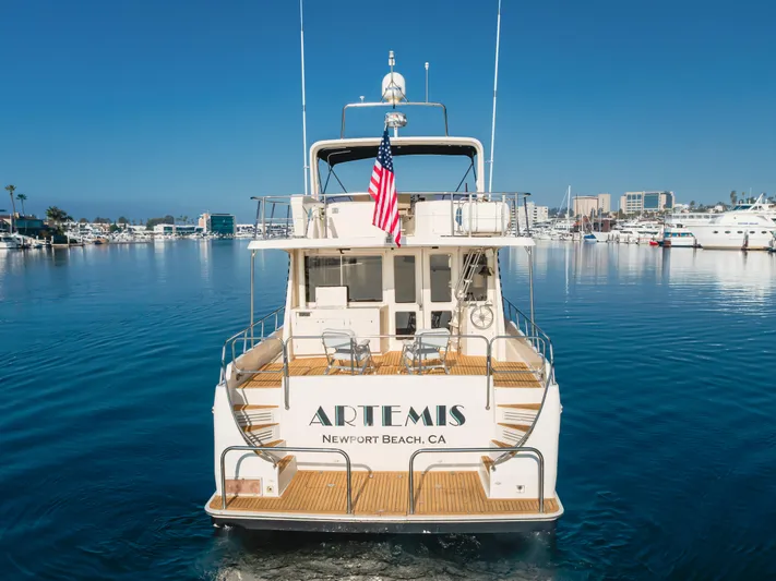 Artemis Yacht Photos Pics 1996 Offshore Yachts Pilothouse in Newport Beach marina, rear view with American flag.
