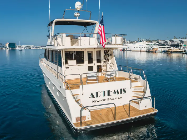 Artemis Yacht Photos Pics 1996 Offshore Yachts Pilothouse in Newport Beach marina, displaying American flag.