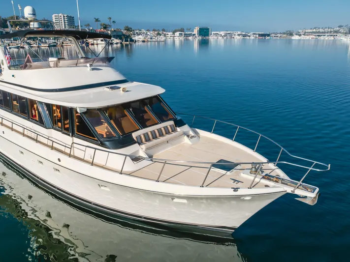 Artemis Yacht Photos Pics 1996 Offshore Yachts Pilothouse on calm water, showcasing elegant design and spacious deck.