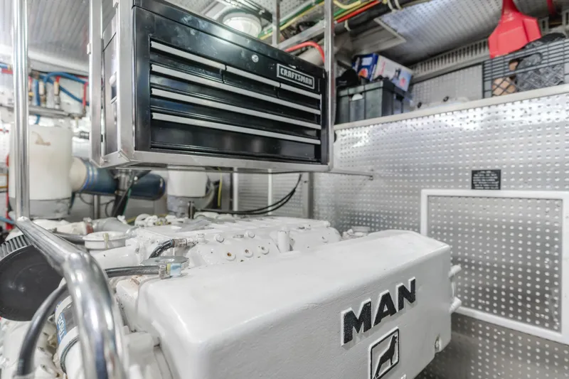 Artemis Yacht Photos Pics Engine room of 1996 Offshore Yachts Pilothouse with MAN engine and tool chest.