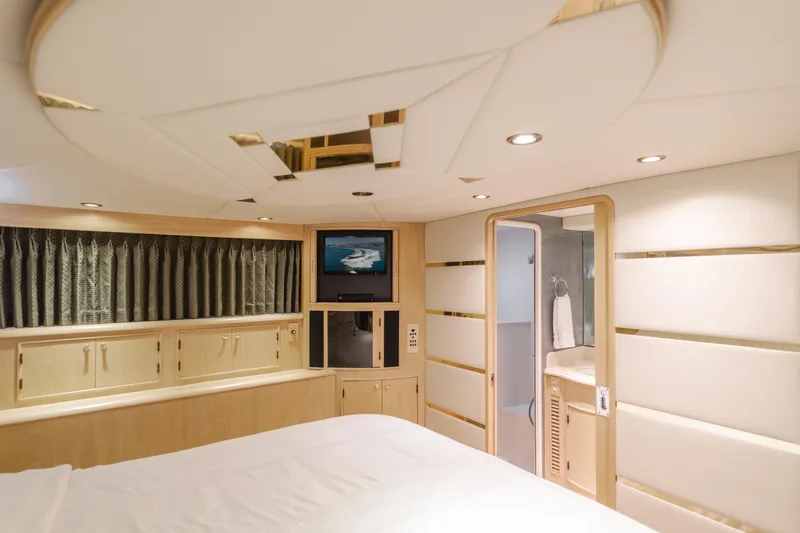 Artemis Yacht Photos Pics Luxurious interior of a 1996 Offshore Yachts Pilothouse, featuring a cozy bedroom and modern amenities.