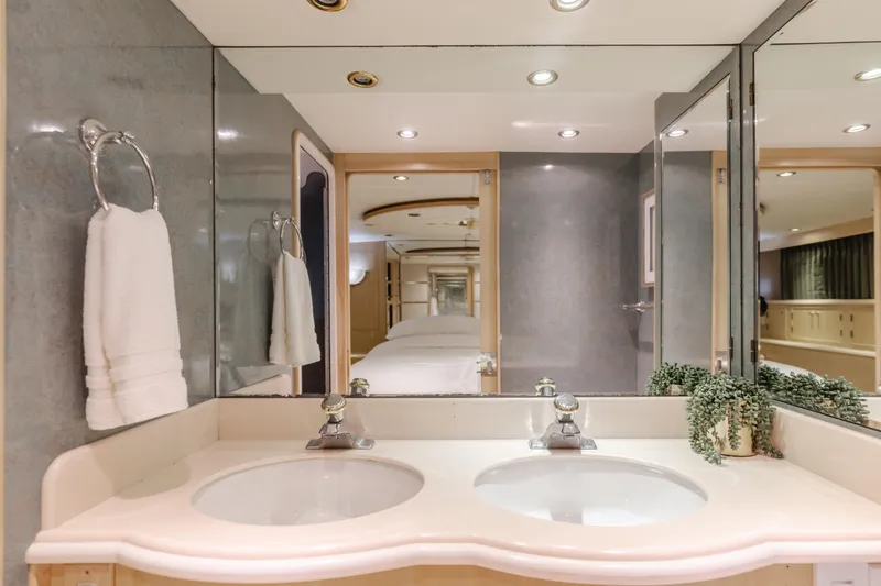 Artemis Yacht Photos Pics Luxurious bathroom in 1996 Offshore Yachts Pilothouse with dual sinks and elegant decor.