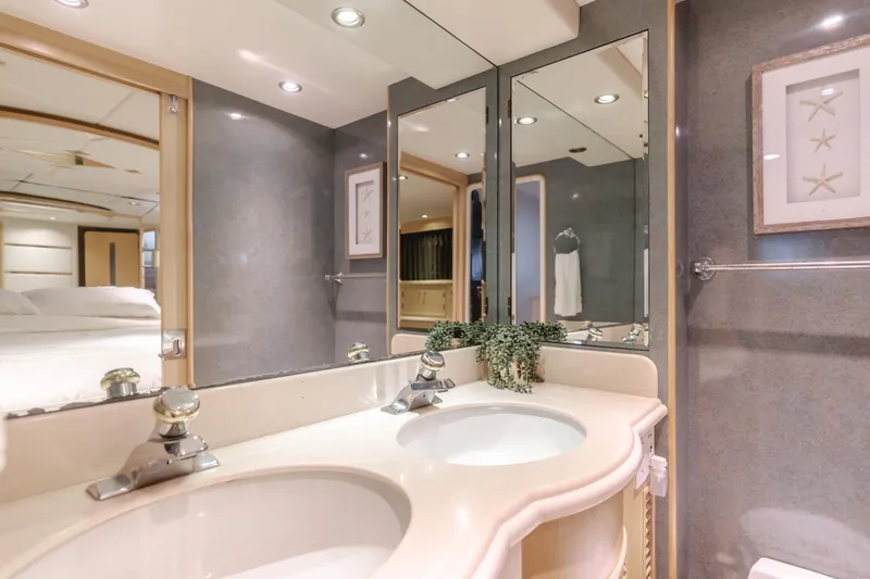 Artemis Yacht Photos Pics Luxurious bathroom in 1996 Offshore Yachts Pilothouse, featuring dual sinks and elegant decor.