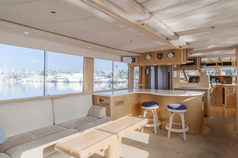 Artemis Yacht Photos Pics Luxurious interior of a 1996 Offshore Yachts Pilothouse with spacious seating and panoramic windows.