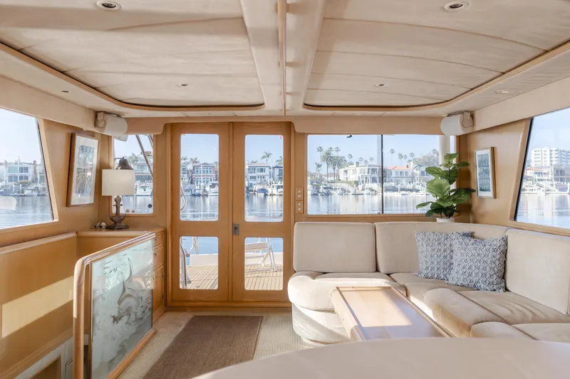 Artemis Yacht Photos Pics Luxurious interior of a 1996 Offshore Yachts Pilothouse with panoramic marina views.