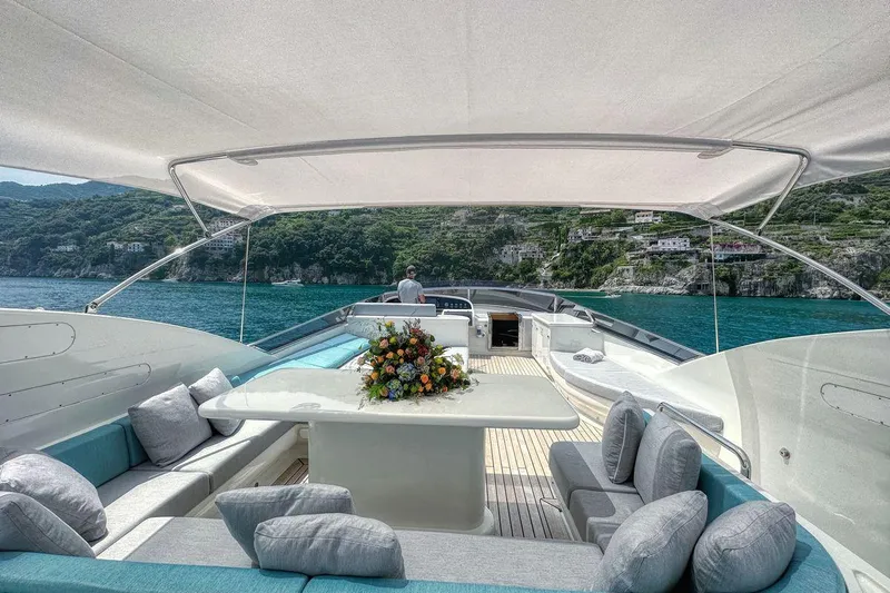 Dea One Yacht Photos Pics Luxurious Antago 90 DEA ONE yacht interior with elegant seating and scenic ocean view.