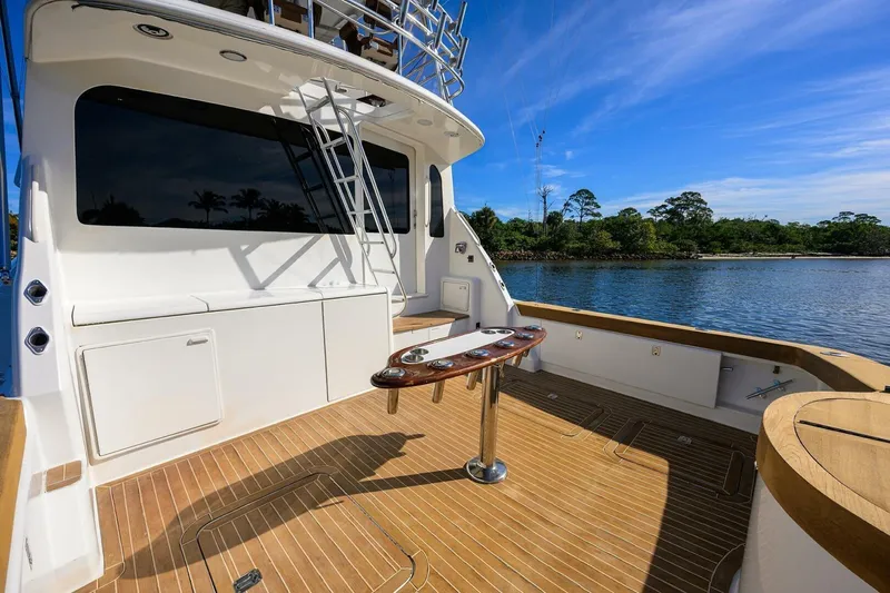 Hook'em Dan O Yacht Photos Pics Luxurious 2006 Ocean Yachts 57 Super Sport yacht deck with scenic water view.