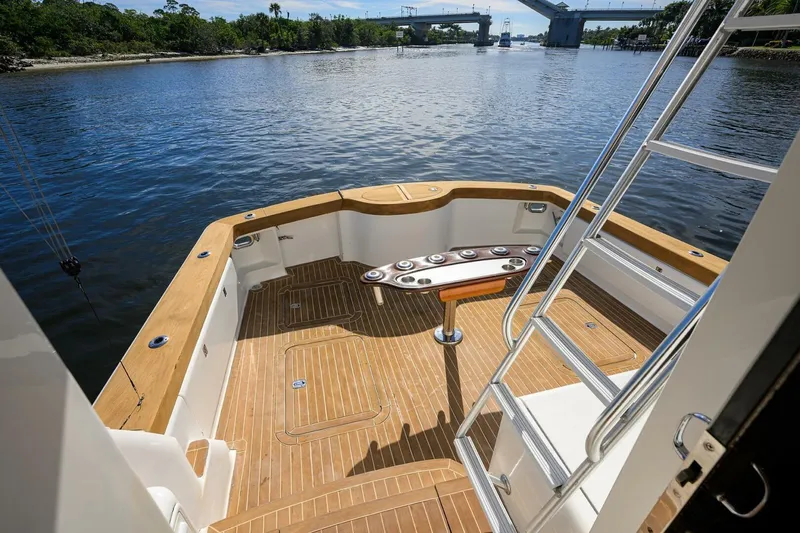Hook'em Dan O Yacht Photos Pics 2006 Ocean Yachts 57 Super Sport yacht deck with scenic waterway view.