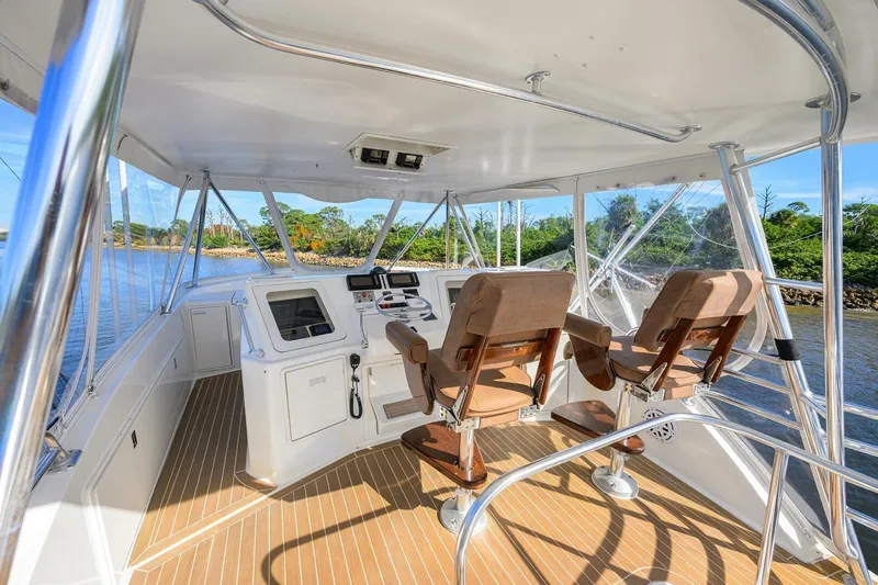 Hook'em Dan O Yacht Photos Pics 2006 Ocean Yachts 57 Super Sport helm with dual captain chairs and navigation equipment.