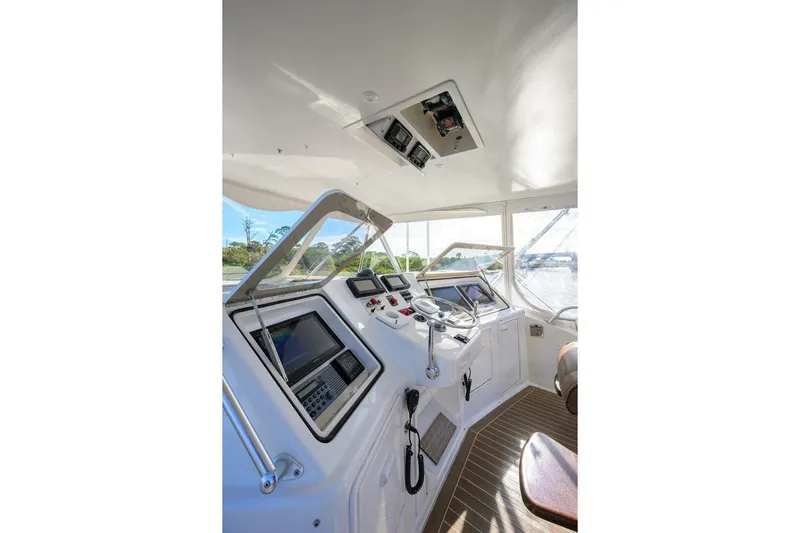 Hook'em Dan O Yacht Photos Pics Helm of 2006 Ocean Yachts 57 Super Sport with advanced navigation equipment.