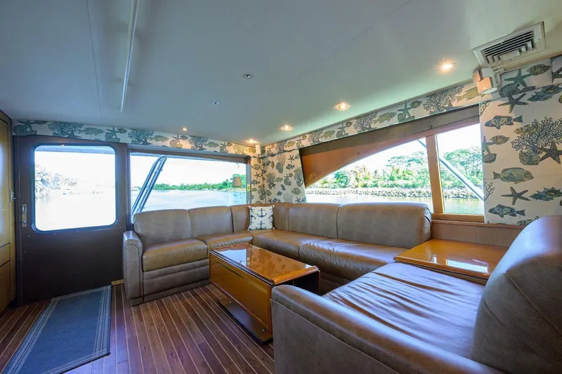 Hook'em Dan O Yacht Photos Pics Luxurious interior of 2006 Ocean Yachts 57 Super Sport with leather seating and scenic windows.