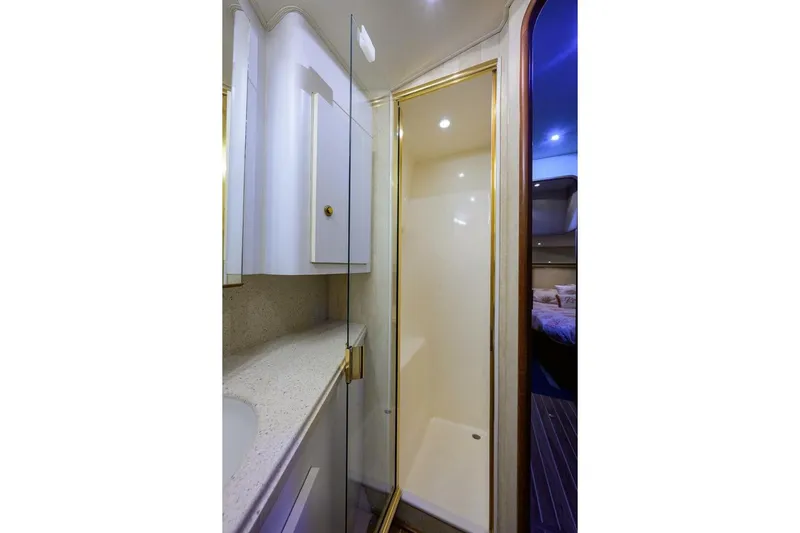 Hook'em Dan O Yacht Photos Pics Luxurious bathroom interior of 2006 Ocean Yachts 57 Super Sport with shower and vanity.