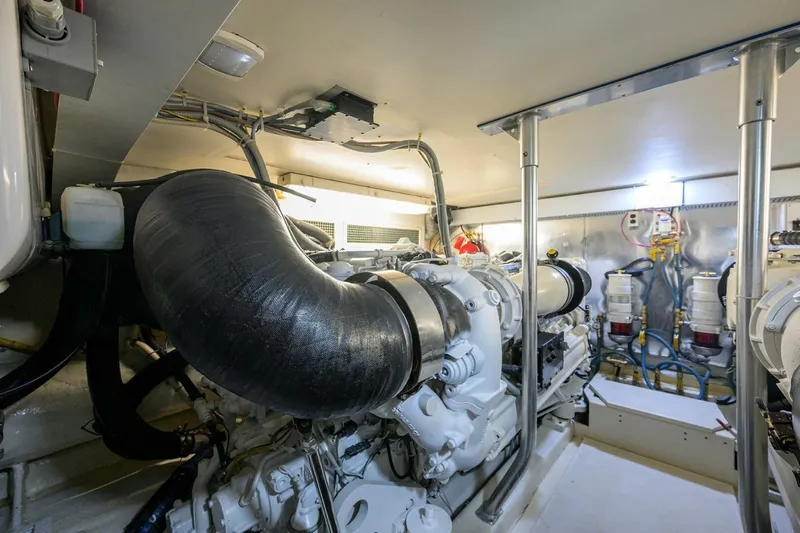 Hook'em Dan O Yacht Photos Pics Engine room of 2006 Ocean Yachts 57 Super Sport, showcasing powerful marine machinery.