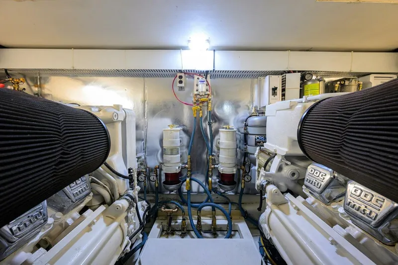 Hook'em Dan O Yacht Photos Pics Engine room of 2006 Ocean Yachts 57 Super Sport, featuring dual engines and mechanical components.