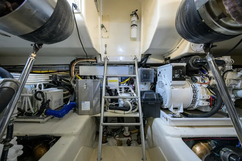 Hook'em Dan O Yacht Photos Pics Engine room of 2006 Ocean Yachts 57 Super Sport, showcasing mechanical equipment and systems.
