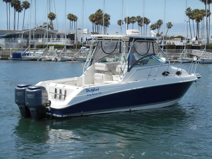 Delfini Yacht Photos Pics 2007 Wellcraft Coastal 270 boat docked in marina with twin 250 engines.