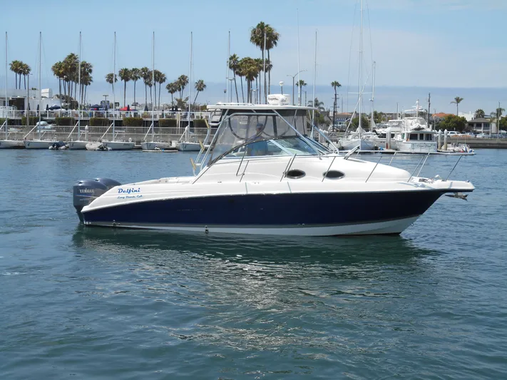 Delfini Yacht Photos Pics 2007 Wellcraft Coastal 270 boat docked in a marina.