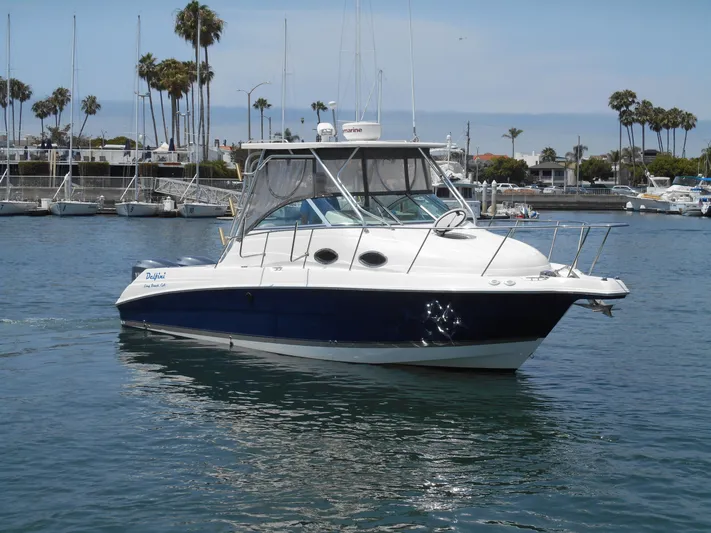 Delfini Yacht Photos Pics 2007 Wellcraft Coastal 270 boat docked in a marina.