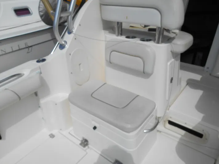 Delfini Yacht Photos Pics 2007 Wellcraft Coastal 270 boat interior with seating and storage compartments.