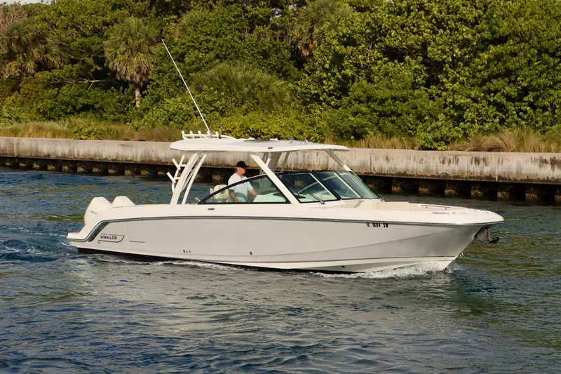  Yacht Photos Pics 2021 Boston Whaler 320 Vantage cruising on a scenic waterway.