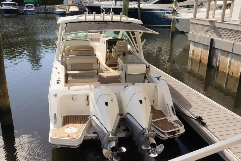  Yacht Photos Pics 2021 Boston Whaler 320 Vantage docked, showcasing dual engines and spacious seating.