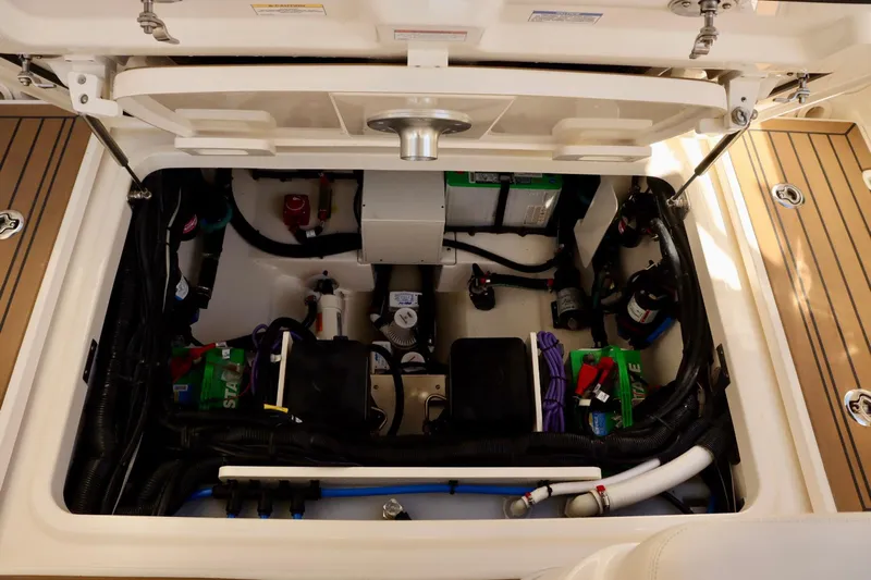  Yacht Photos Pics 2021 Boston Whaler 320 Vantage engine compartment, showcasing organized wiring and components.