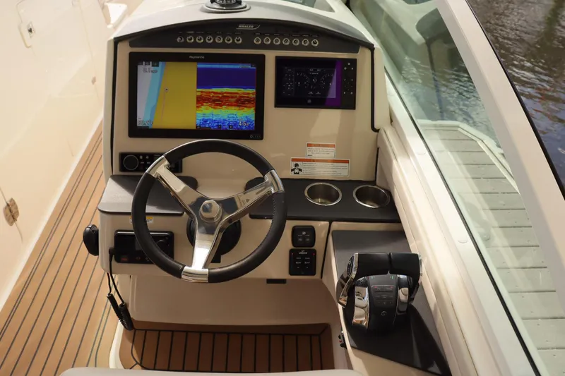  Yacht Photos Pics 2021 Boston Whaler 320 Vantage helm with advanced navigation display and controls.