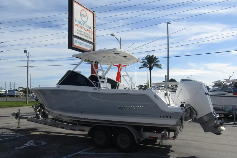  Yacht Photos Pics 2023 Blackfin 252 DC boat on trailer at Nautical Ventures dealership.