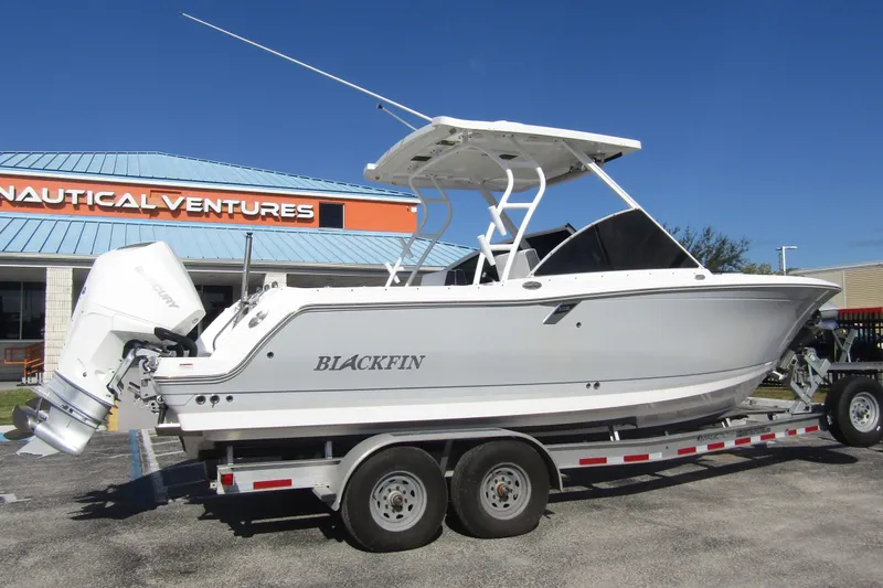  Yacht Photos Pics 2023 Blackfin 252 DC boat on trailer at Nautical Ventures dealership.