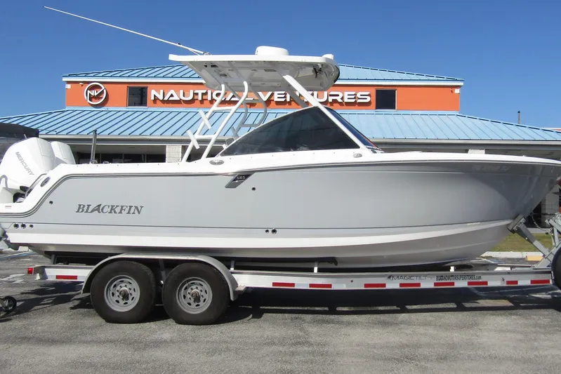  Yacht Photos Pics 2023 Blackfin 252 DC boat on trailer at Nautical Ventures dealership.
