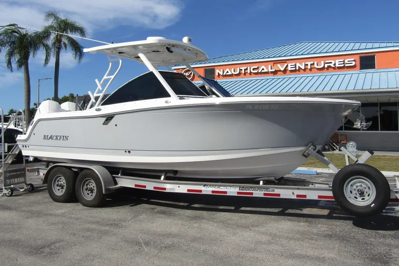  Yacht Photos Pics 2023 Blackfin 252 DC boat on trailer at Nautical Ventures dealership.
