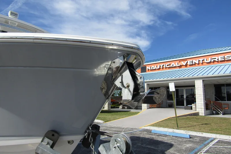  Yacht Photos Pics 2023 Blackfin 252 DC boat at Nautical Ventures dealership under blue sky.