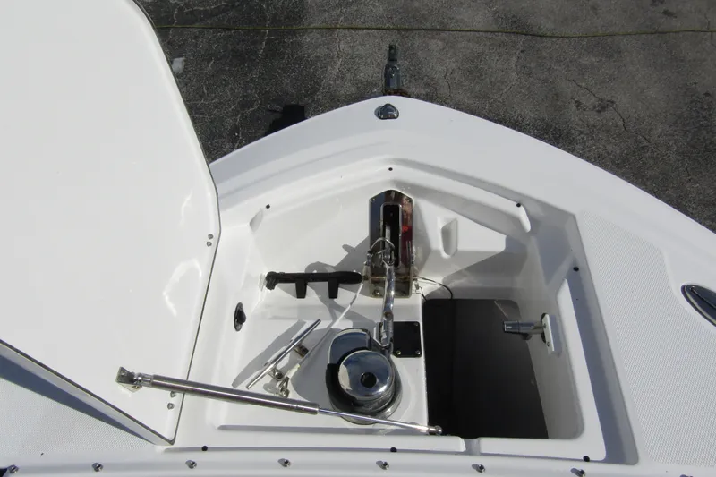  Yacht Photos Pics 2023 Blackfin 252 DC boat anchor compartment with open hatch, showcasing storage and equipment.