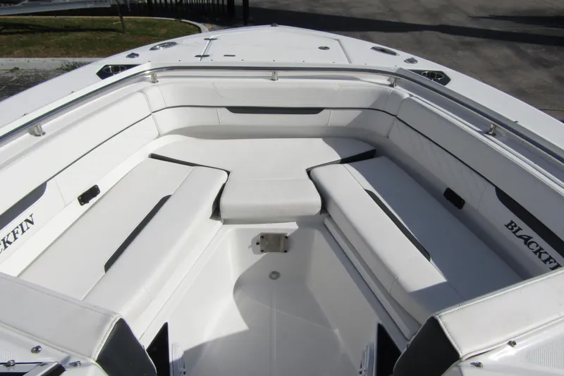  Yacht Photos Pics 2023 Blackfin 252 DC boat interior with white cushioned seating.