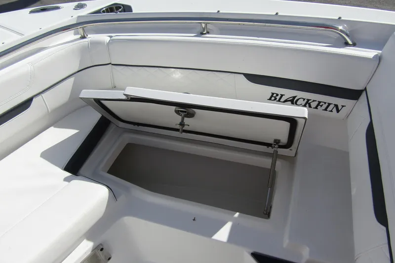  Yacht Photos Pics 2023 Blackfin 252 DC boat interior with open storage compartment.