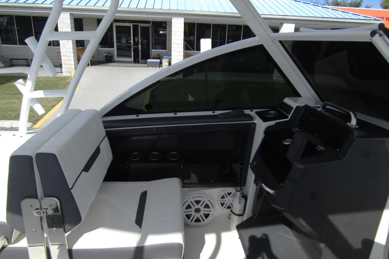  Yacht Photos Pics 2023 Blackfin 252 DC boat interior with seating and storage compartments.