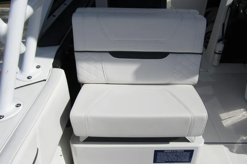  Yacht Photos Pics 2023 Blackfin 252 DC boat seat with white upholstery and diamond stitching.
