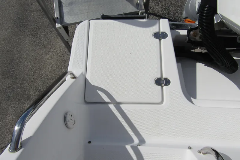  Yacht Photos Pics 2023 Blackfin 252 DC boat deck with storage compartment and stainless steel railing.