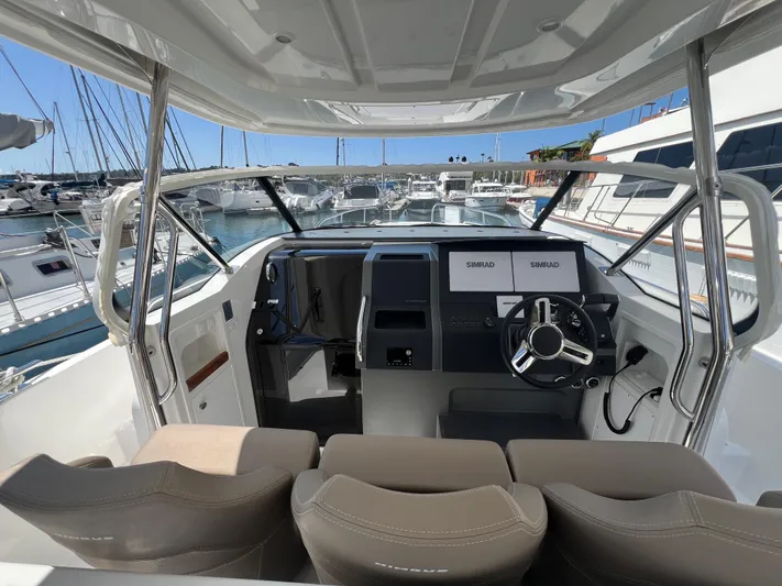 San #292 In Stock Yacht Photos Pics 2024 Nimbus T11 boat cockpit with modern steering and navigation system.