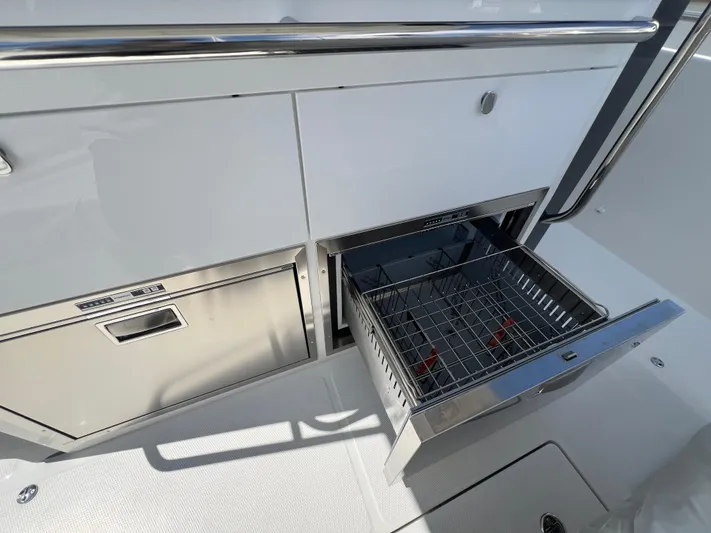 San #292 In Stock Yacht Photos Pics Open storage compartment on Nimbus T11 boat, 2024 model, with stainless steel finish.