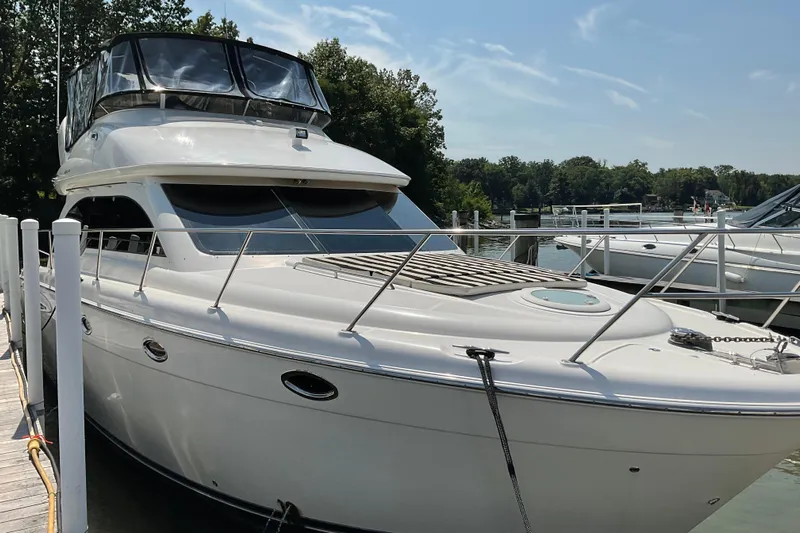  Yacht Photos Pics 2005 Azimut Fly 50 yacht docked, featuring sleek design and spacious flybridge.